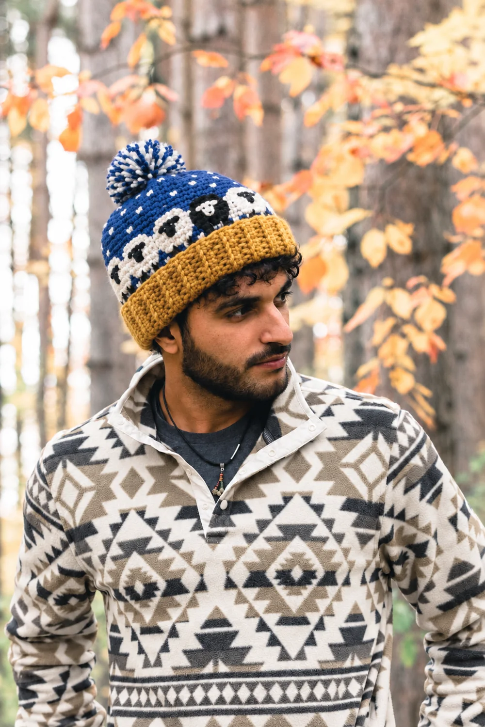 Model wearing a blue, white and yellow Resident Evil crochet beanie